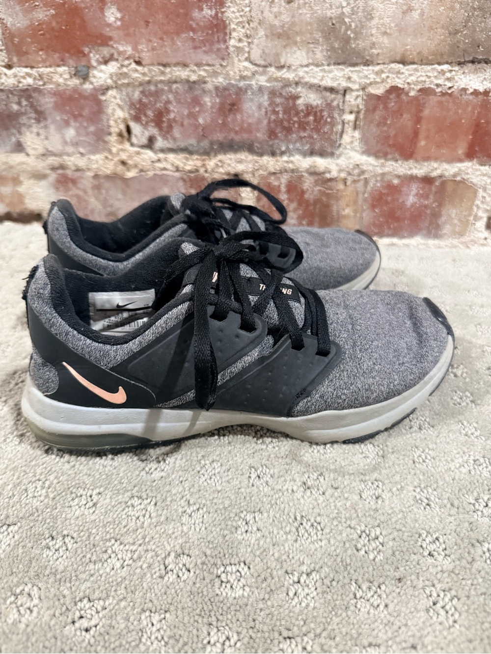 Nike Women's Gray and Black Trainers with Pink Swoosh Accent
